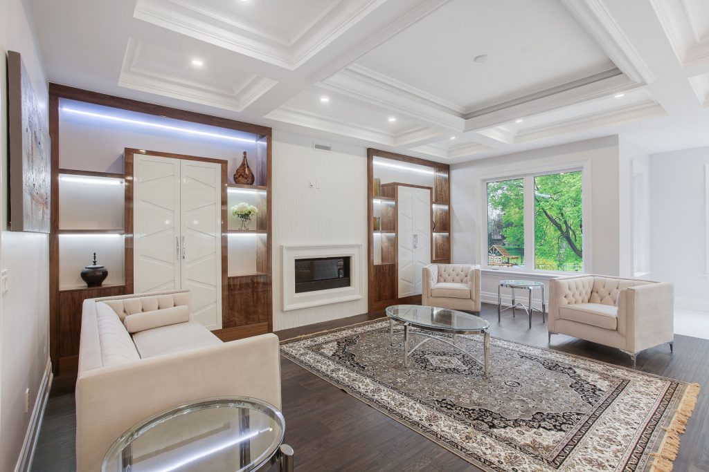 Wall unit in high gloss polyurethane paint on walnut veneer and MDF doors
